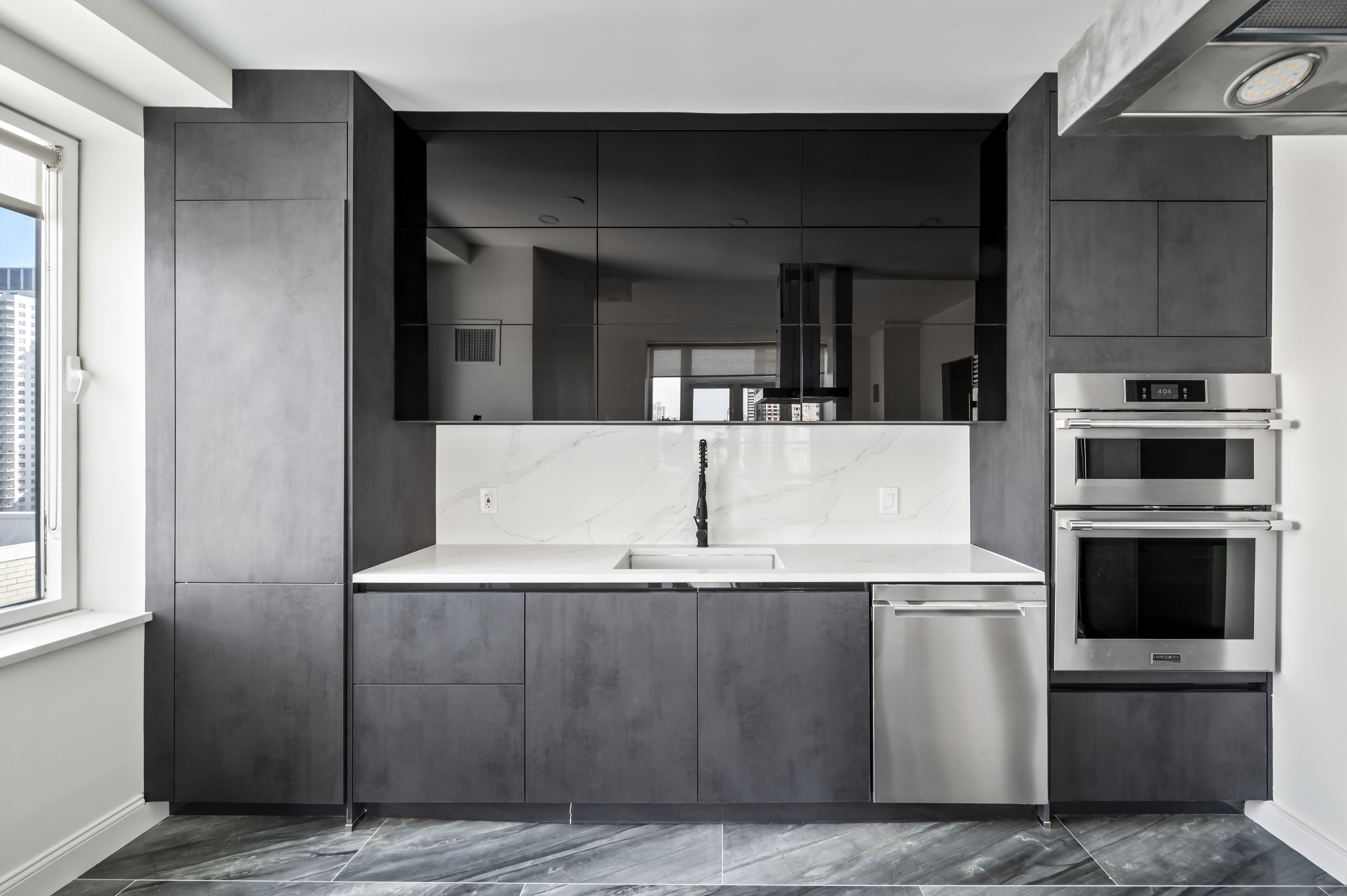 408 East 79th Street, Unit 16B Manhattan, NY 10075 - Photo 6 of 16 a view of a kitchen with a sink and dishwasher