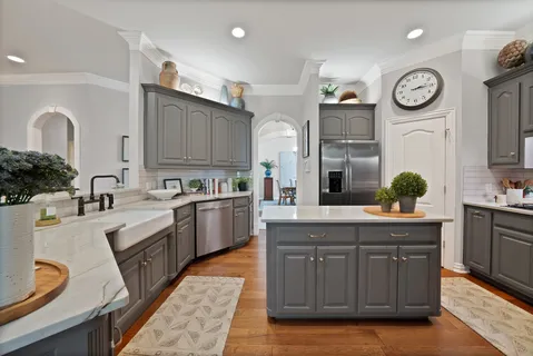 a kitchen with a sink cabinets and stainless steel appliances