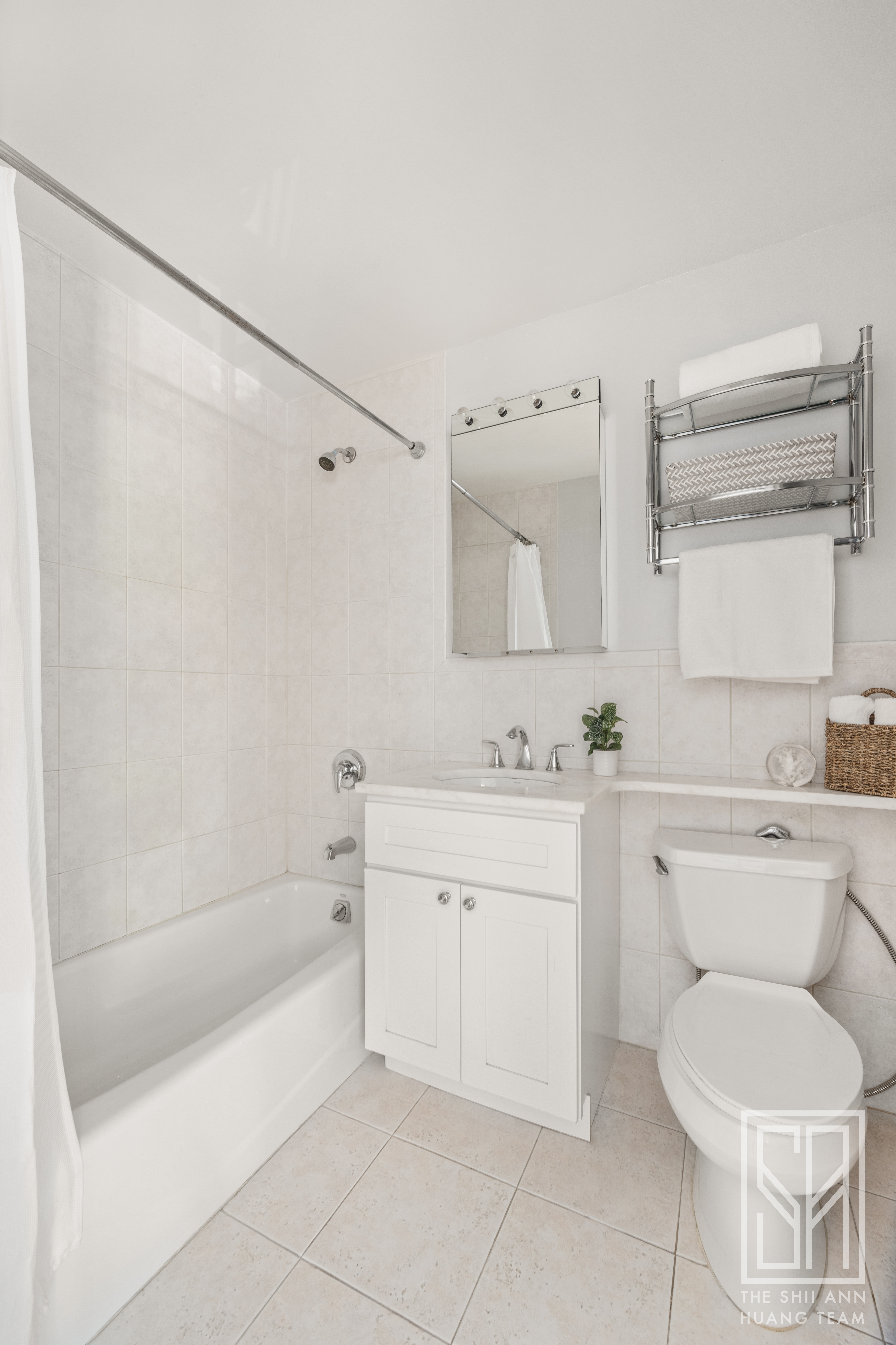 305 3rd Street, Unit 2H Brooklyn, NY 11215 - Photo 7 of 14 a bathroom with a sink toilet and shower