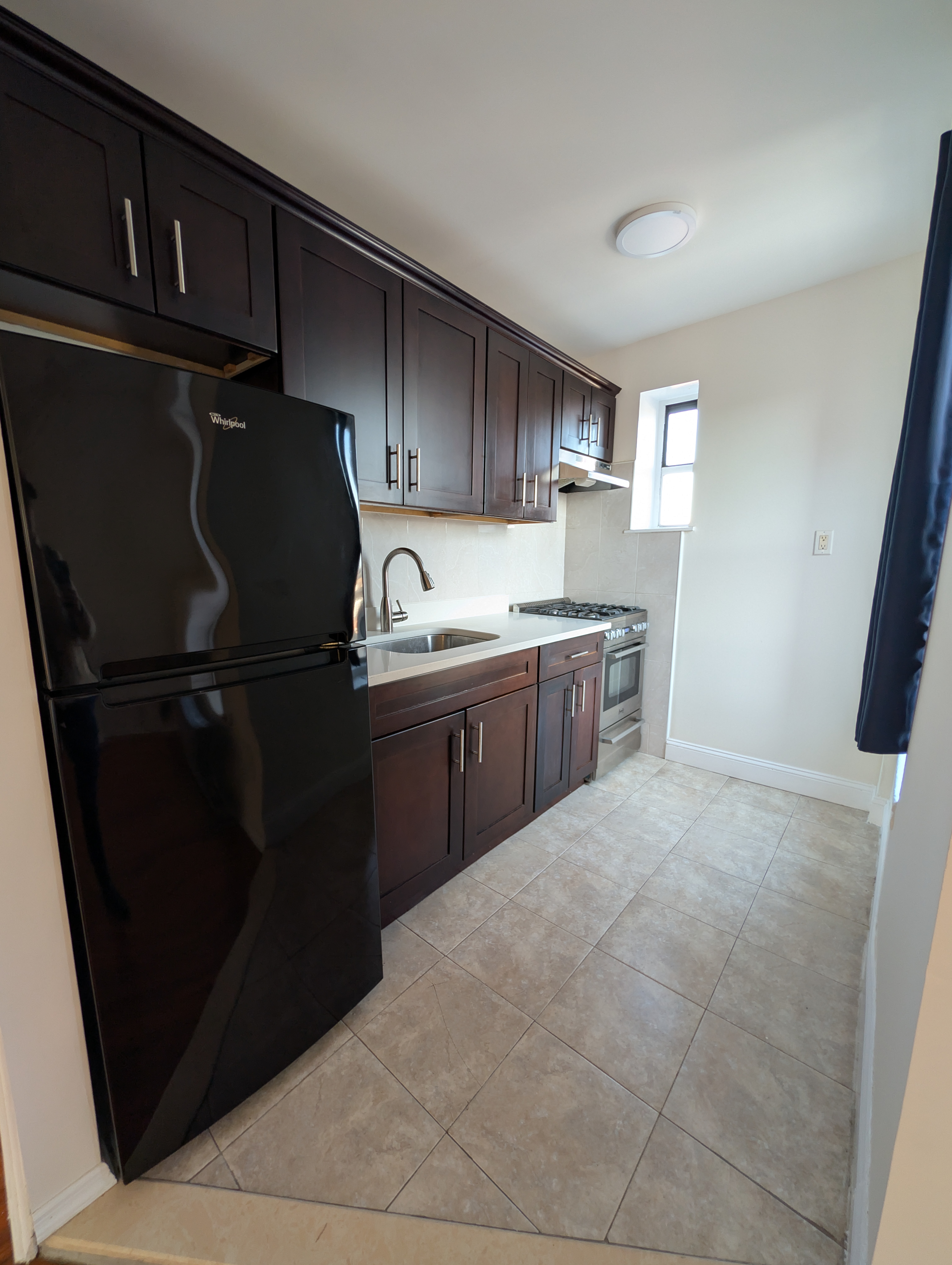 443 Hicks Street, Unit 6H Brooklyn, NY 11201 - Photo 6 of 11 a kitchen with stainless steel appliances granite countertop a refrigerator and a sink