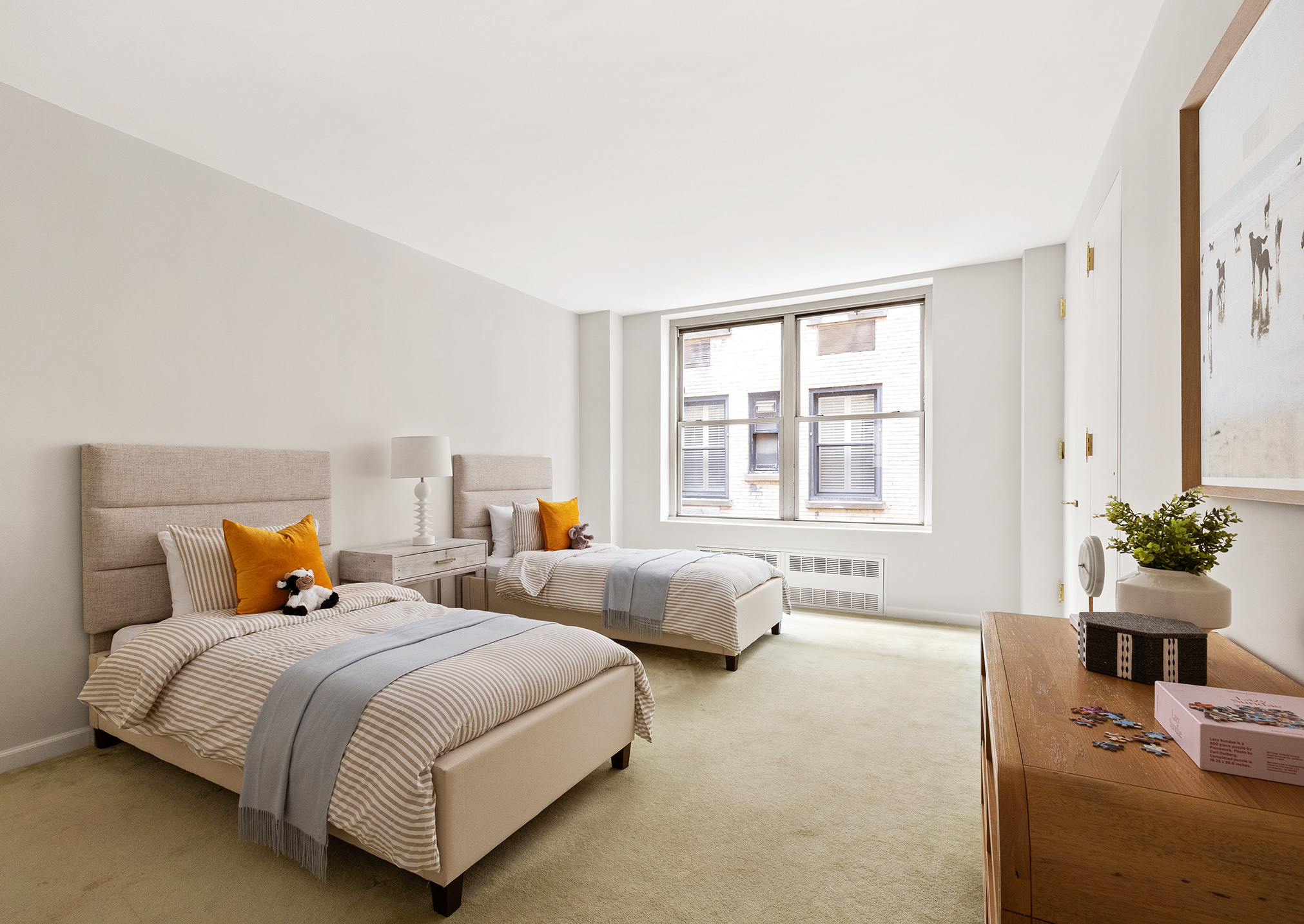 33 East 70th Street, Unit 9D Manhattan, NY 10021 - Photo 12 of 15 a bedroom with bed and windows