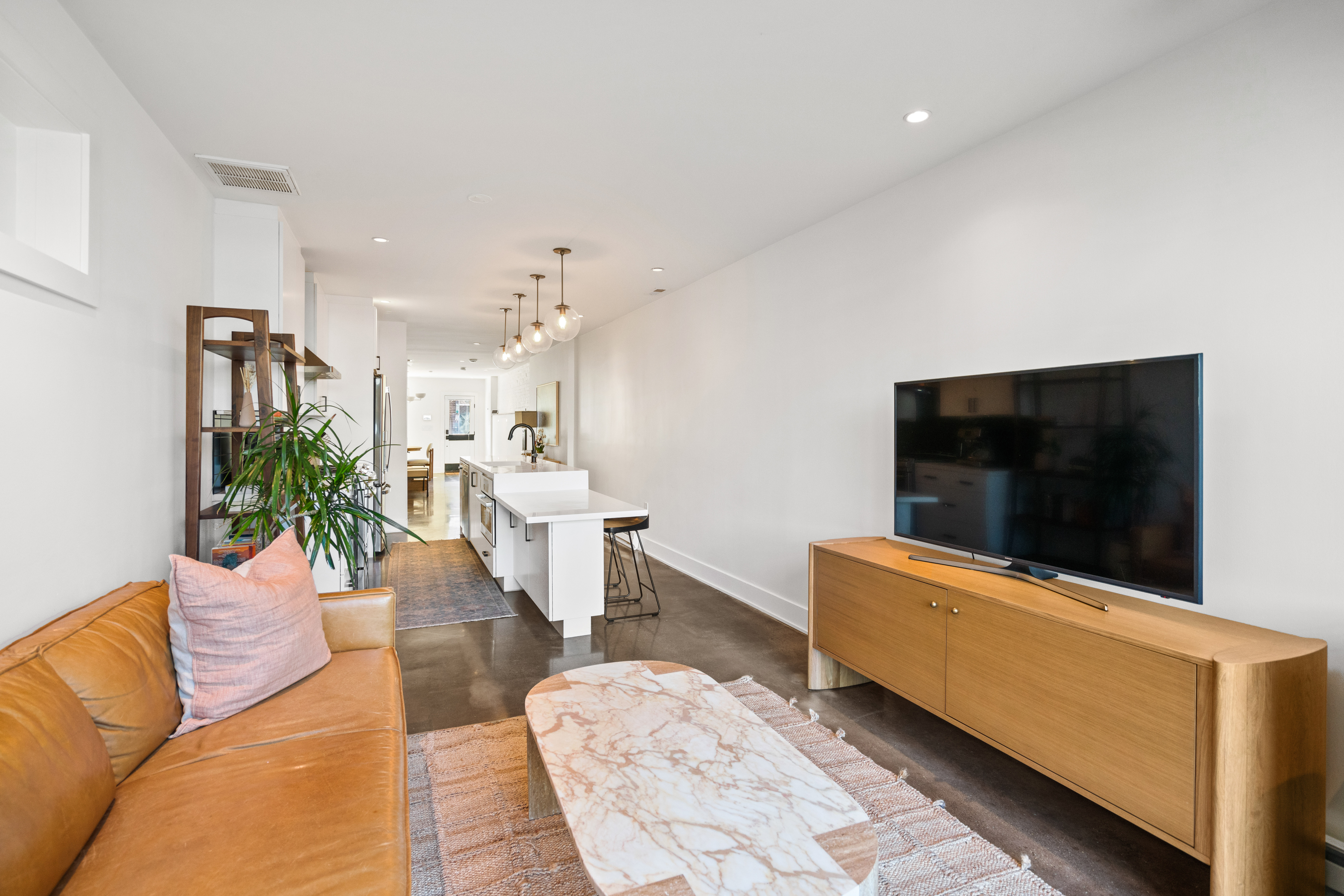 445 Ridge Street Northwest Washington, DC 20001 - Photo 16 of 43 a living room with furniture and a flat screen tv
