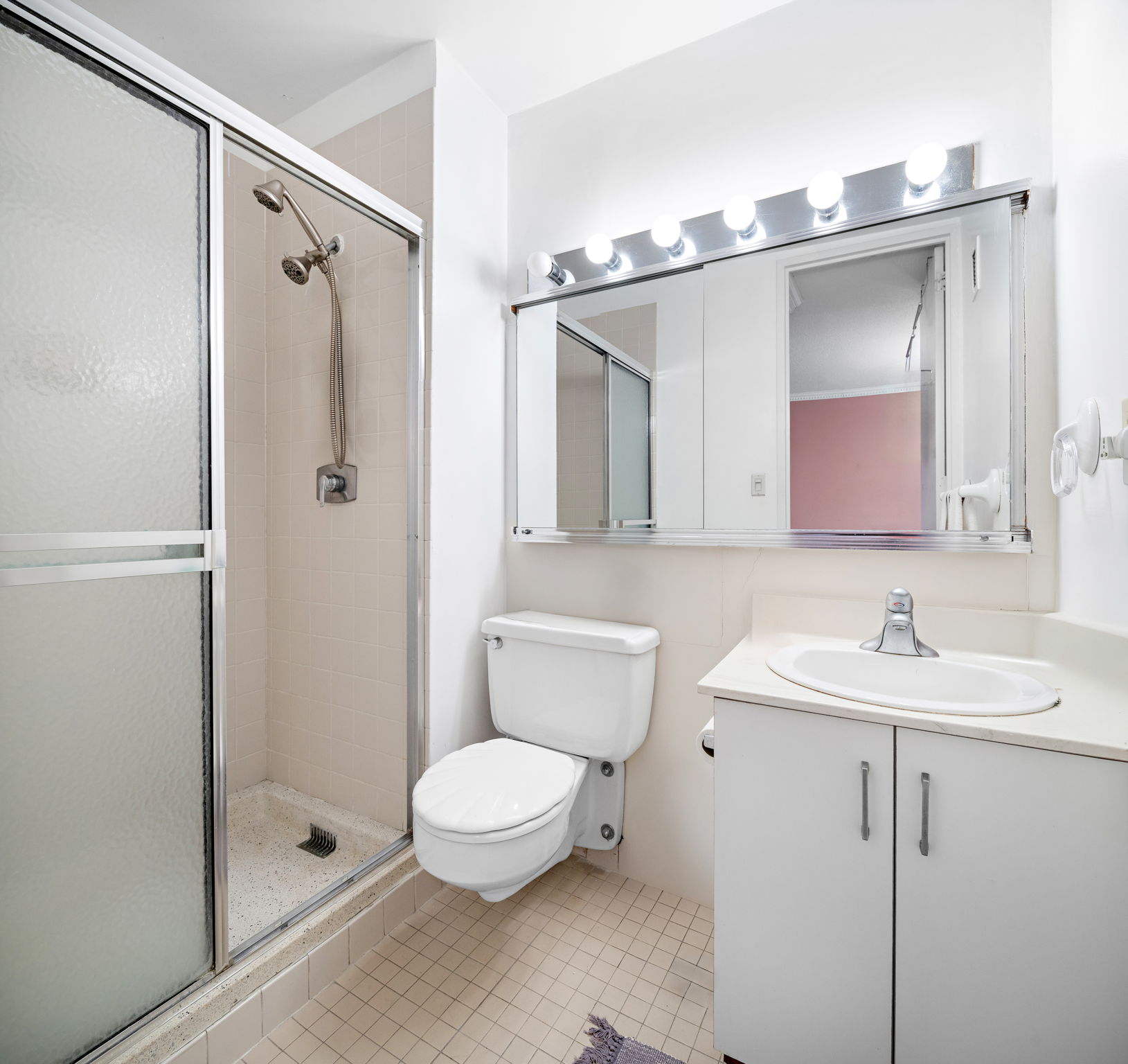 7004 JFK Boulevard East, Unit 40G Guttenberg, NJ 07093 - Photo 10 of 22 a bathroom with a toilet sink and shower