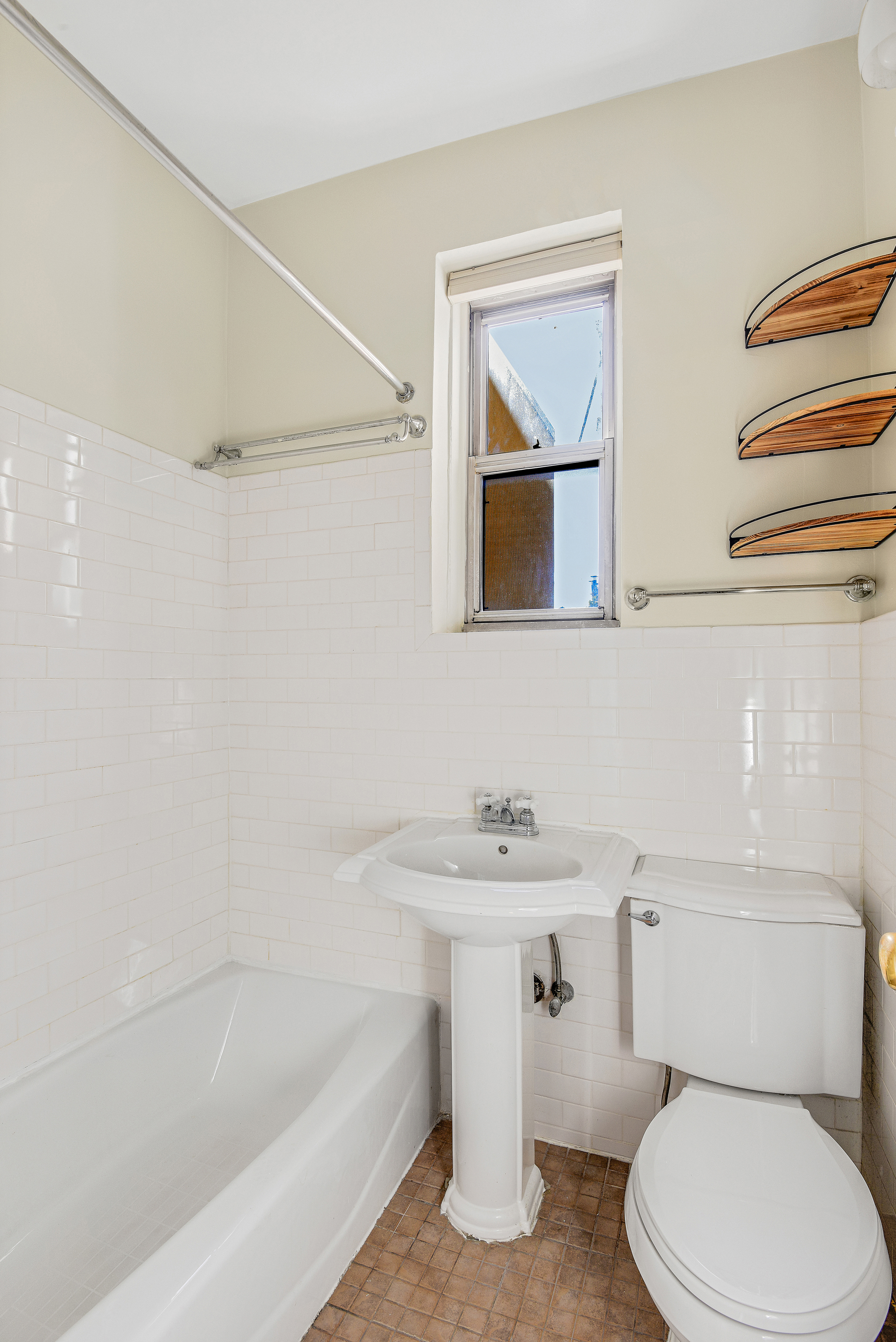 344 West 12th Street, Unit 5C Manhattan, NY 10014 - Photo 6 of 11 a bathroom with a sink a toilet and a bathtub