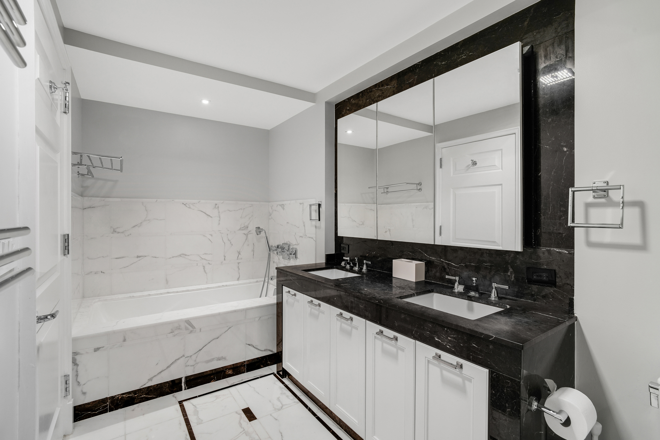 205 East 85th Street, Unit 16H Manhattan, NY 10028 - Photo 7 of 14 a bathroom with a sink and a mirror