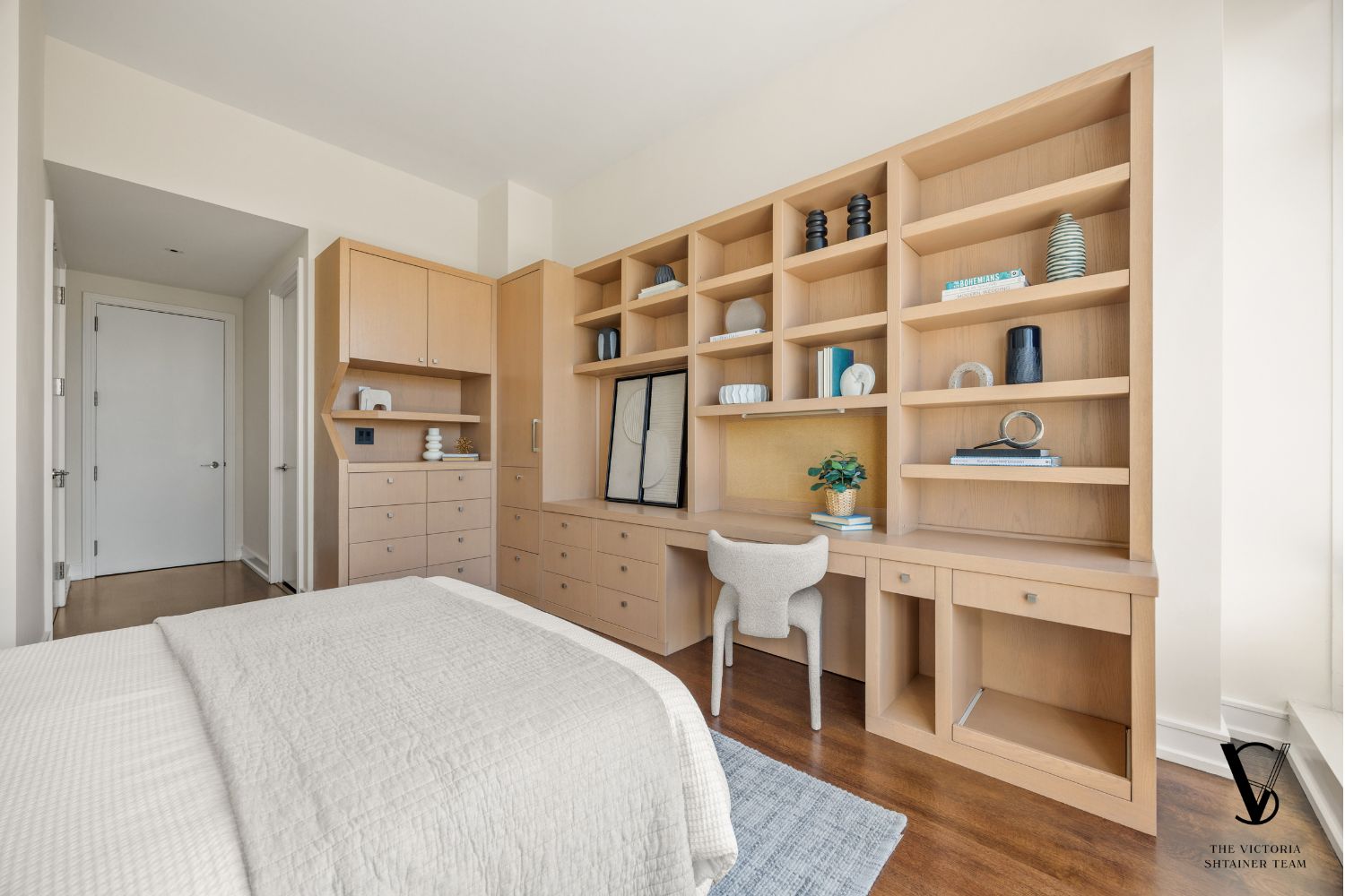 151 East 58th Street, Unit 32C Manhattan, NY 10022 - Photo 12 of 24 a bedroom with a bed and a cabinets