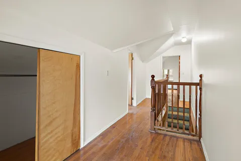 a view of entryway with wooden floor