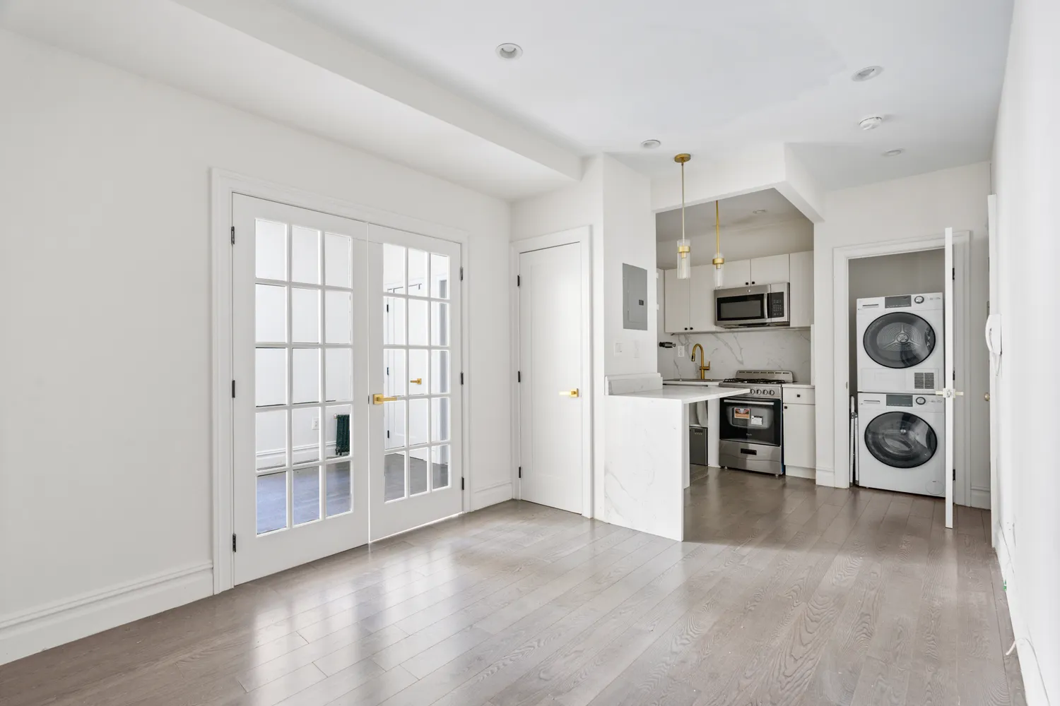 a view of a kitchen with refrigerator and stove top oven