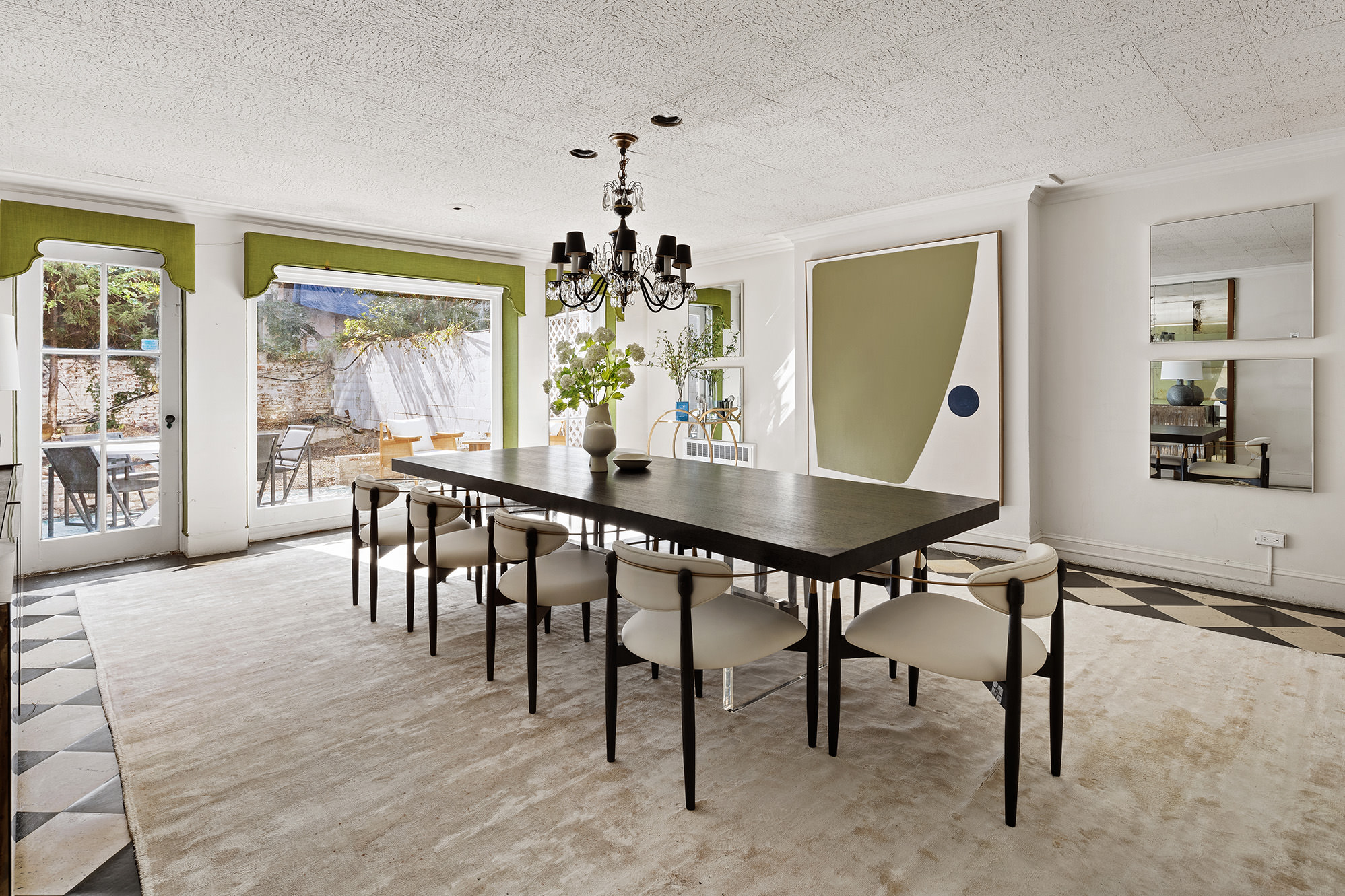 10 East 82nd Street Manhattan, NY 10028 - Photo 19 of 22 a view of a dining room with furniture and a chandelier