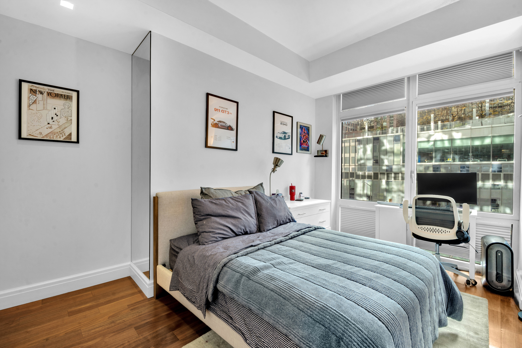 555 West 59th Street, Unit TH3C Manhattan, NY 10019 - Photo 12 of 14 a bedroom with a bed and a large window