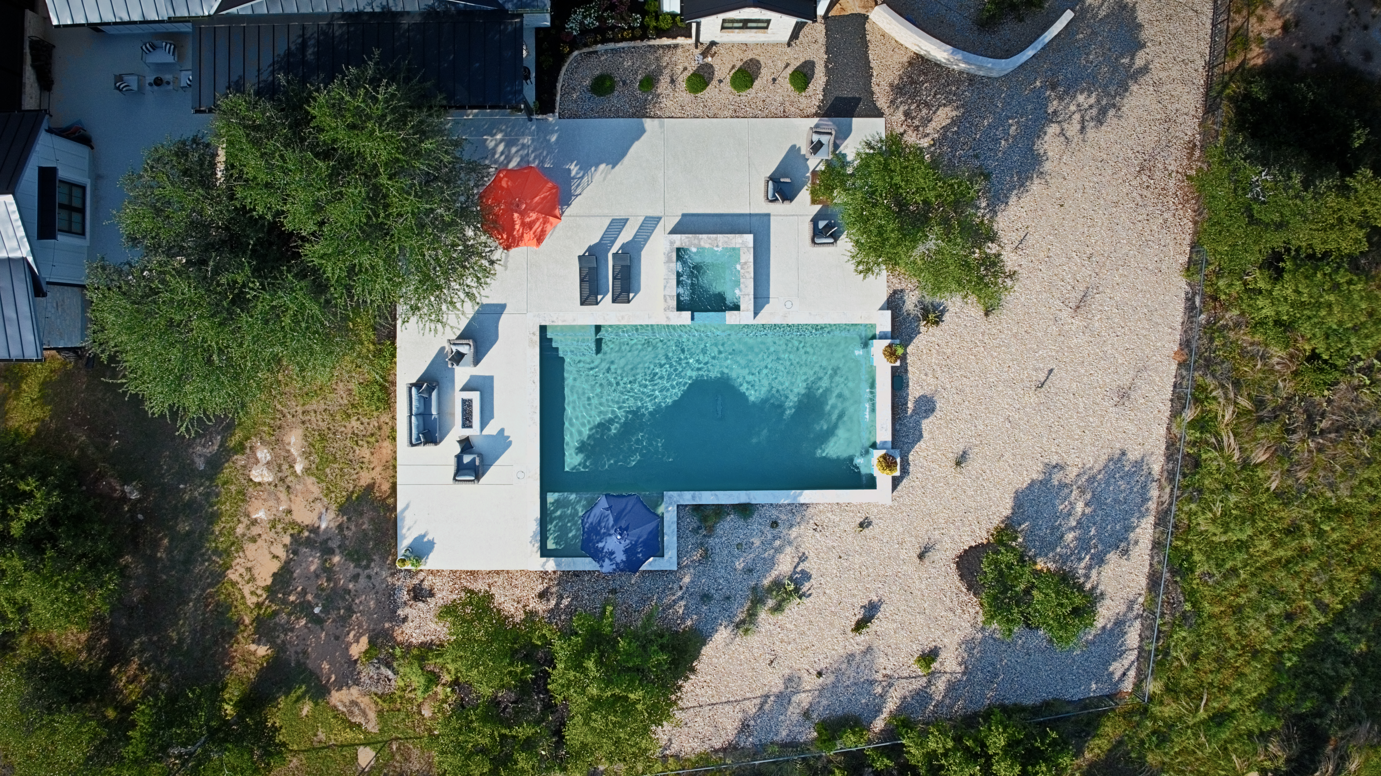 272 Slate Rock Road Willow City, TX 78675 - Photo 27 of 30 an aerial view of house with yard and swimming pool