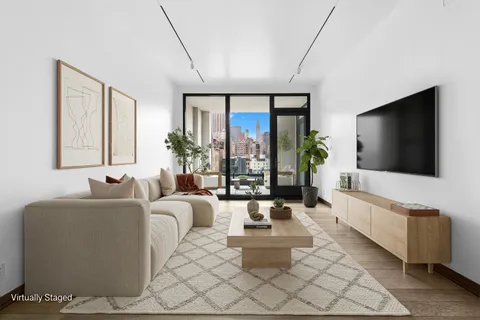 a living room with fireplace furniture and a flat screen tv