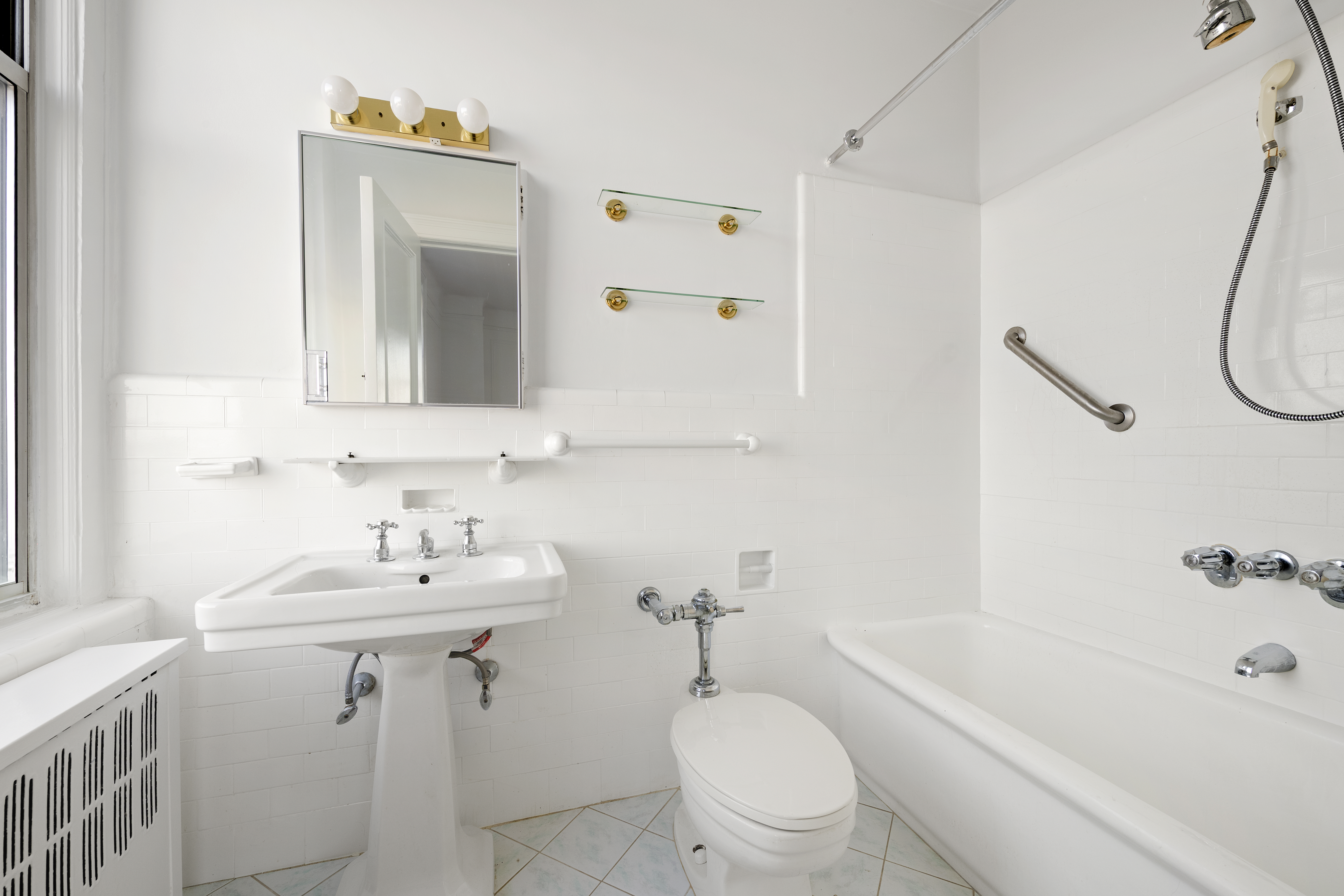 160 Riverside Drive, Unit 8A Manhattan, NY 10024 - Photo 6 of 15 a bathroom with a sink a toilet and shower