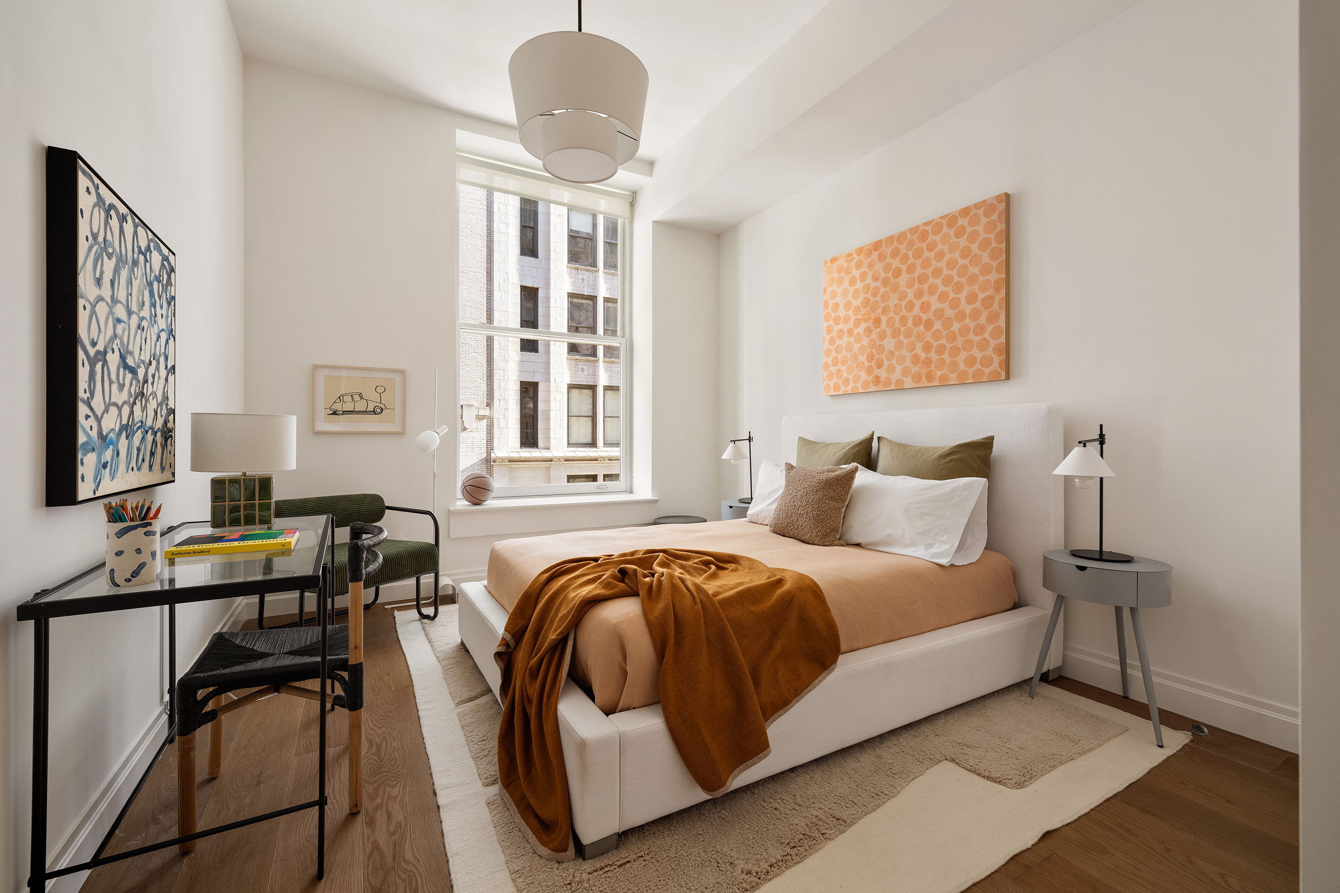 42 East 20th Street, Unit 4AD Manhattan, NY 10003 - Photo 13 of 19 a bedroom with a bed and wooden floor