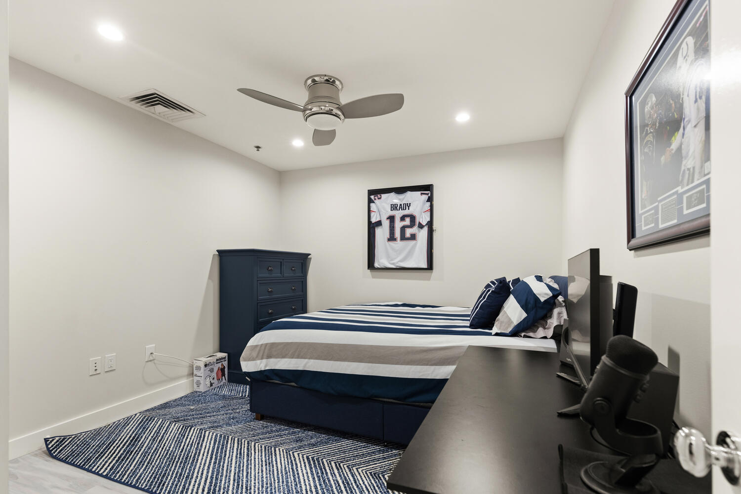 234 Causeway Street, Unit 709 Boston, MA 02114 - Photo 14 of 28 a bedroom with a bed and wooden floor