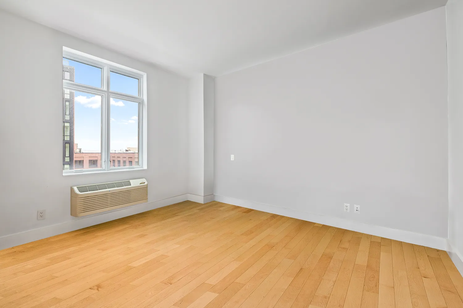 a view of an empty room with a window