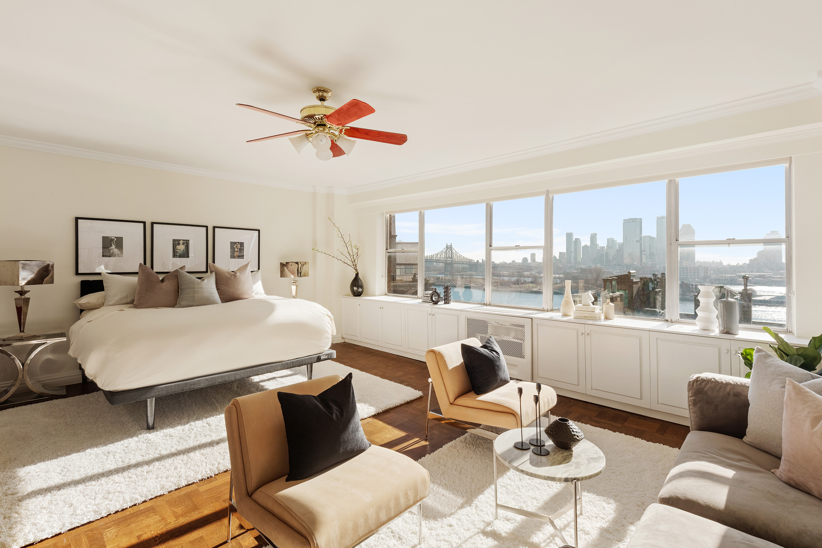 12 Beekman Place, Unit 7/8B Manhattan, NY 10022 - Photo 8 of 17 a living room with furniture and a large window