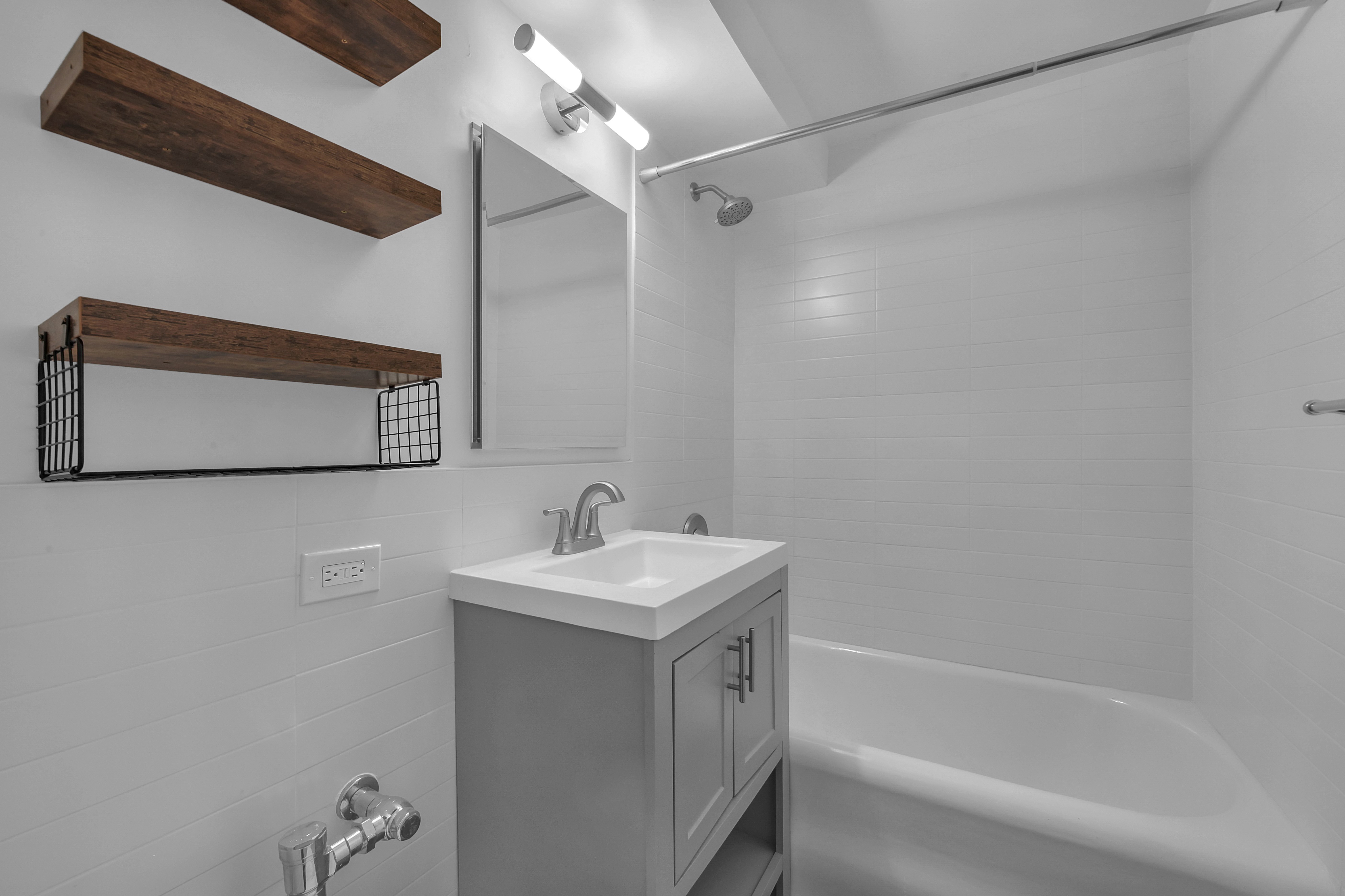 5 Tudor City Place, Unit 1536 Manhattan, NY 10017 - Photo 11 of 21 a bathroom with a sink a toilet and shower