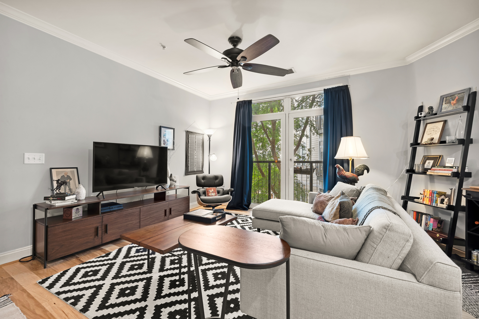 1391 Pennsylvania Ave. Southeast, Unit 324 Washington, DC 20003 - Photo 9 of 33 a living room with furniture and a flat screen tv