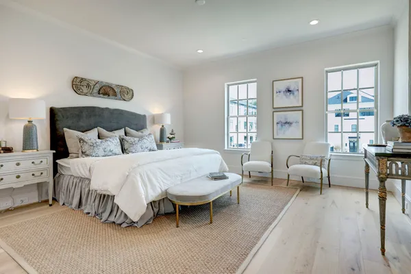 a spacious bedroom with a bed and a couch