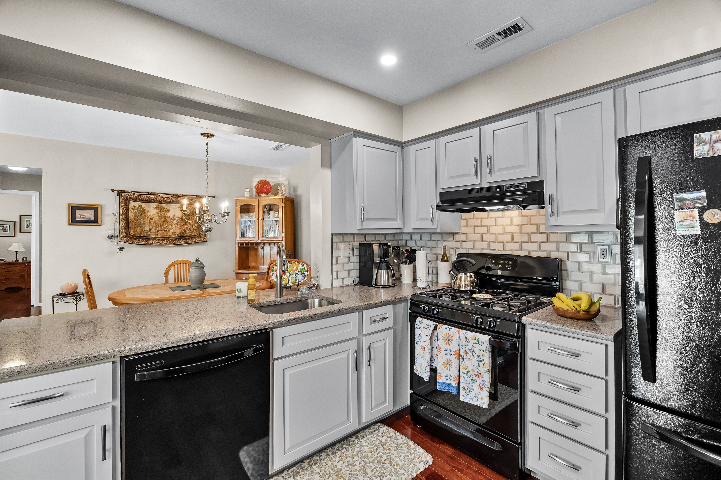 1007 A Yarmouth Lane Mount Laurel, NJ 08054 - Photo 9 of 27 a kitchen with a sink stove and cabinets