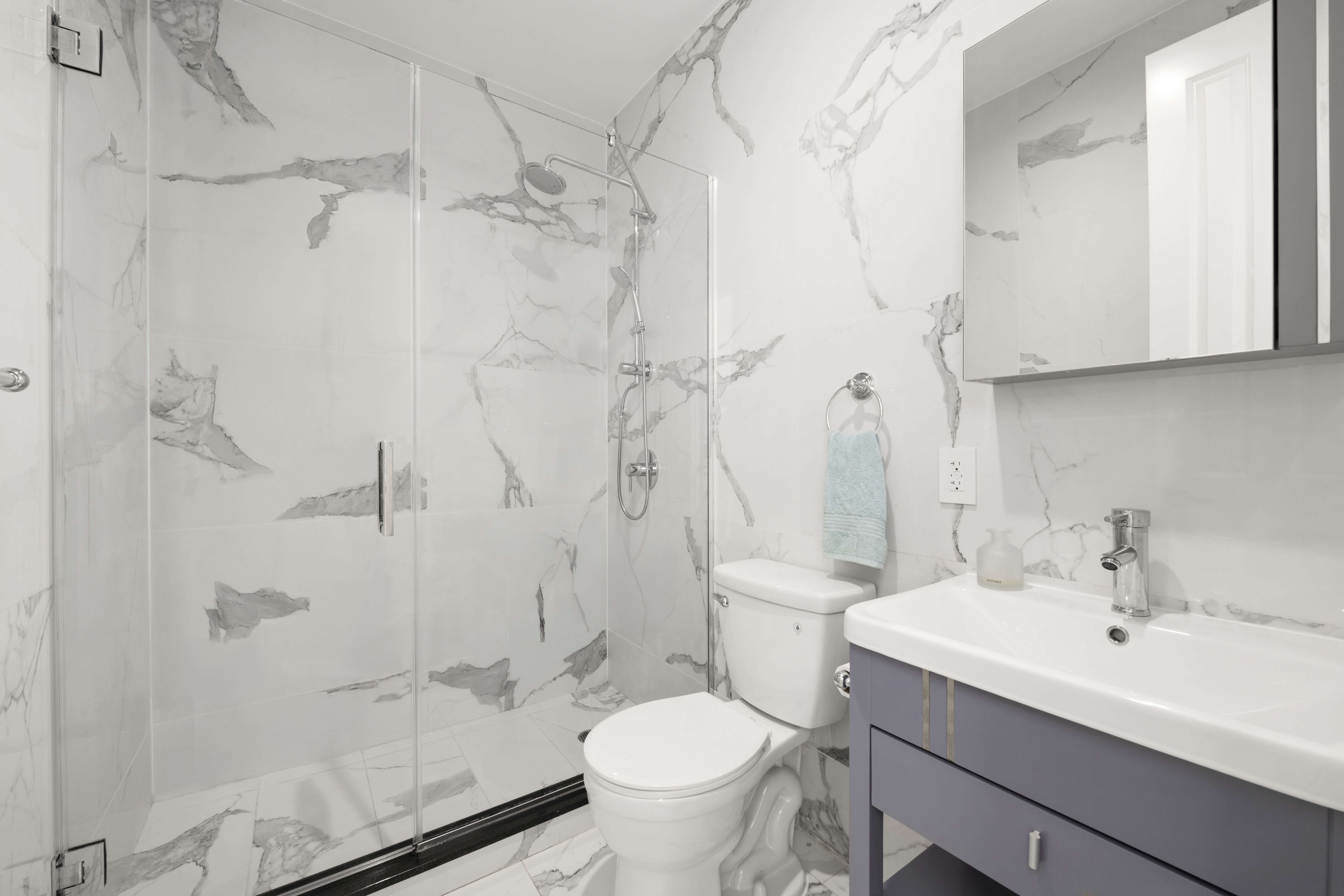 278 Nassau Avenue, Unit 3B Brooklyn, NY 11222 - Photo 6 of 12 a bathroom with a sink toilet and shower