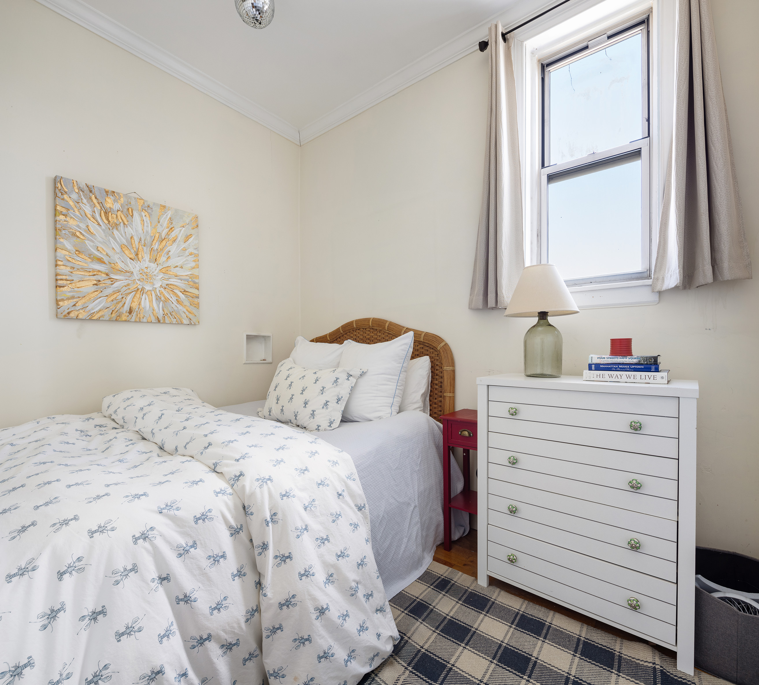 244 West 4th Street, Unit 5D Manhattan, NY 10014 - Photo 2 of 7 a bedroom with a bed and a window