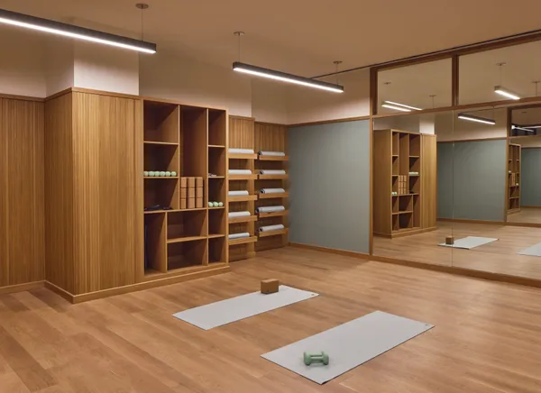 a view of an empty room with closet and wooden floor