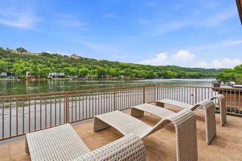 a view of a deck and city view