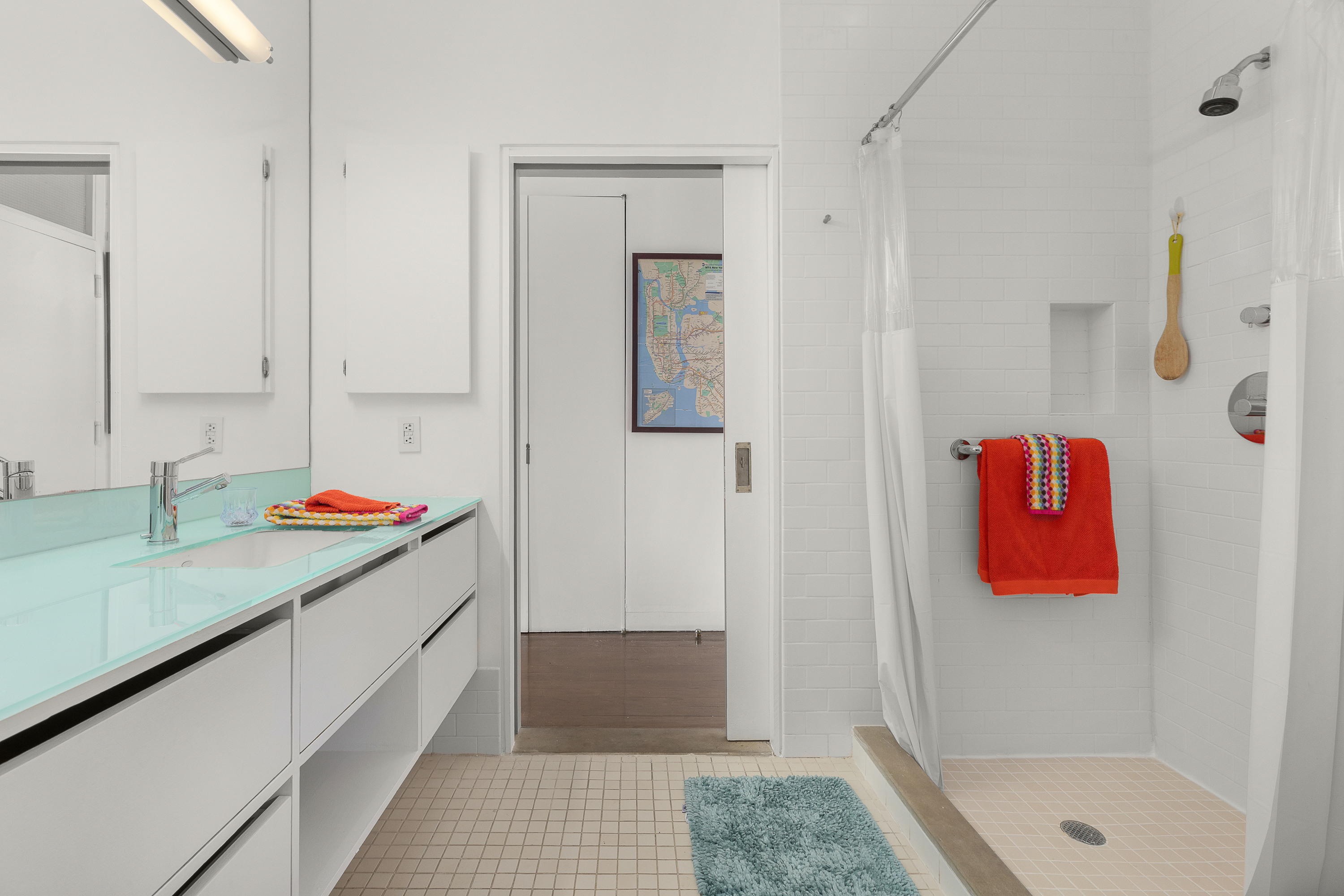 38-06 28th Street, Unit 1 Queens, NY 11101 - Photo 6 of 8 a bathroom with a sink and a shower