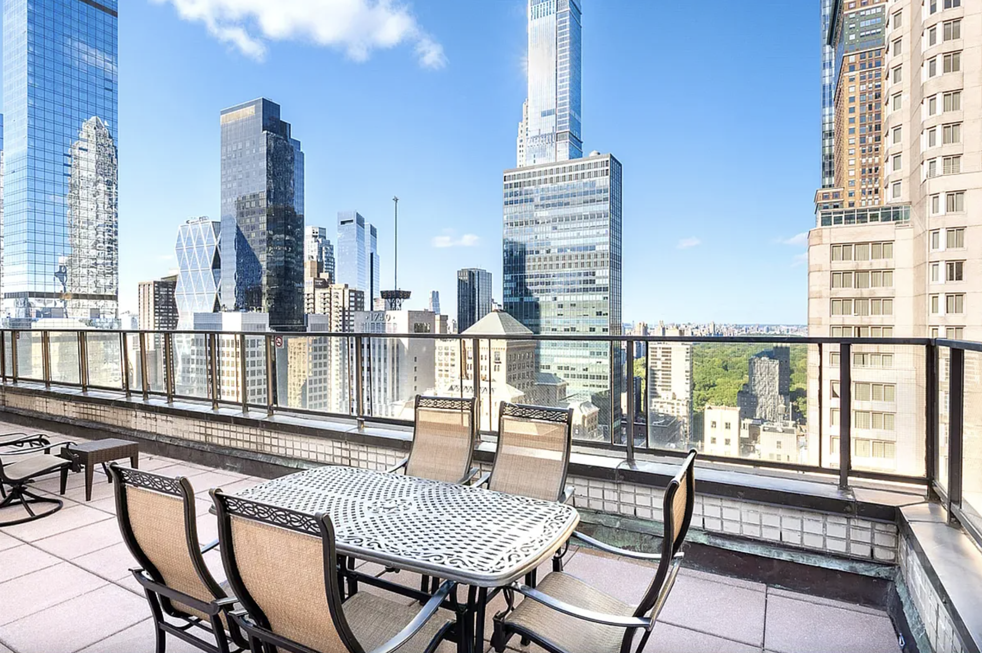 159 East 53rd Street, Unit 10A Manhattan, NY 10022 - Photo 8 of 10 a view of a balcony with two chairs and a potted plant