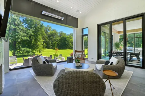 a view of a kitchen with a large window and chandelier