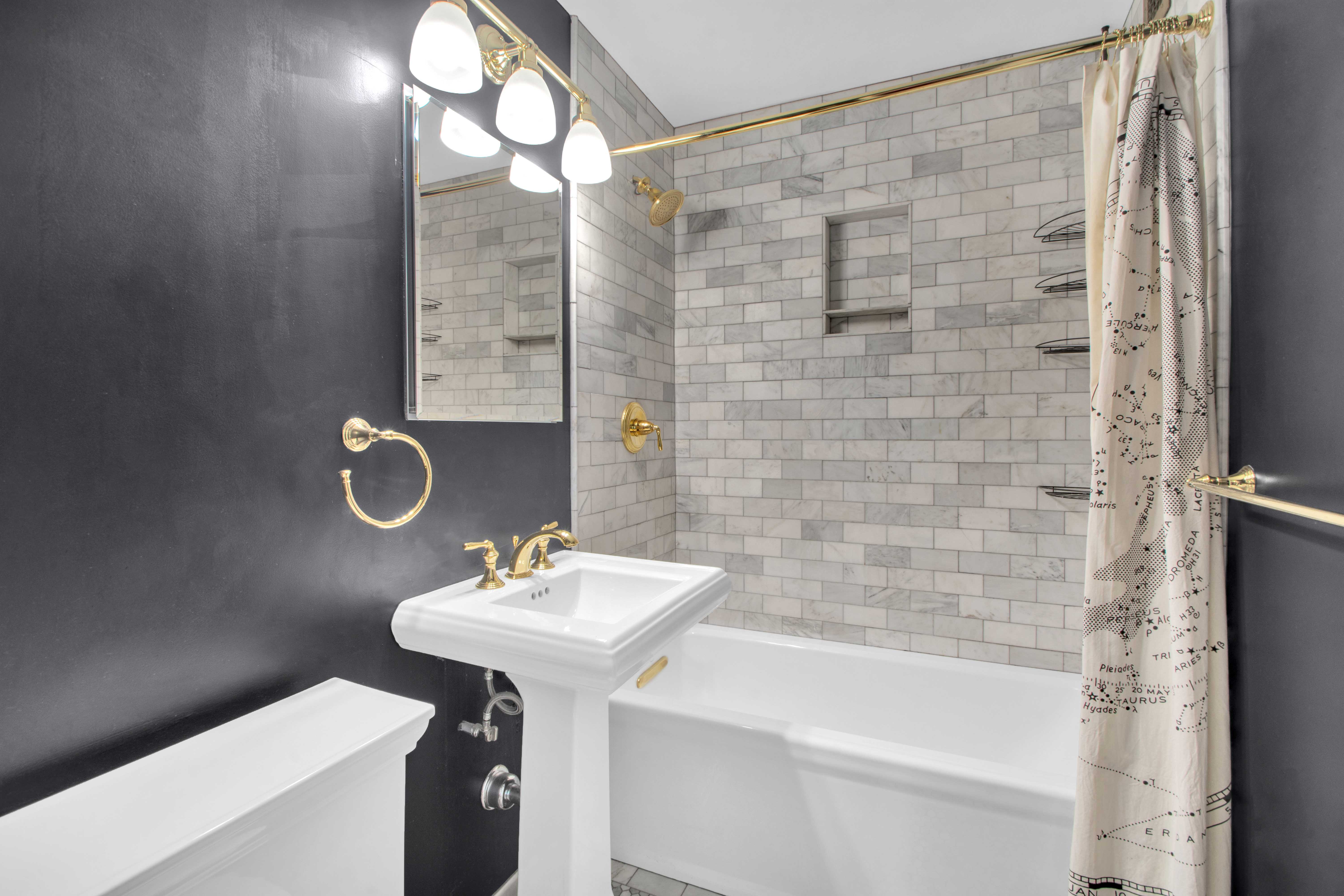 75 Henry Street, Unit 29J Brooklyn, NY 11201 - Photo 7 of 16 a bathroom with a sink a mirror and a shower