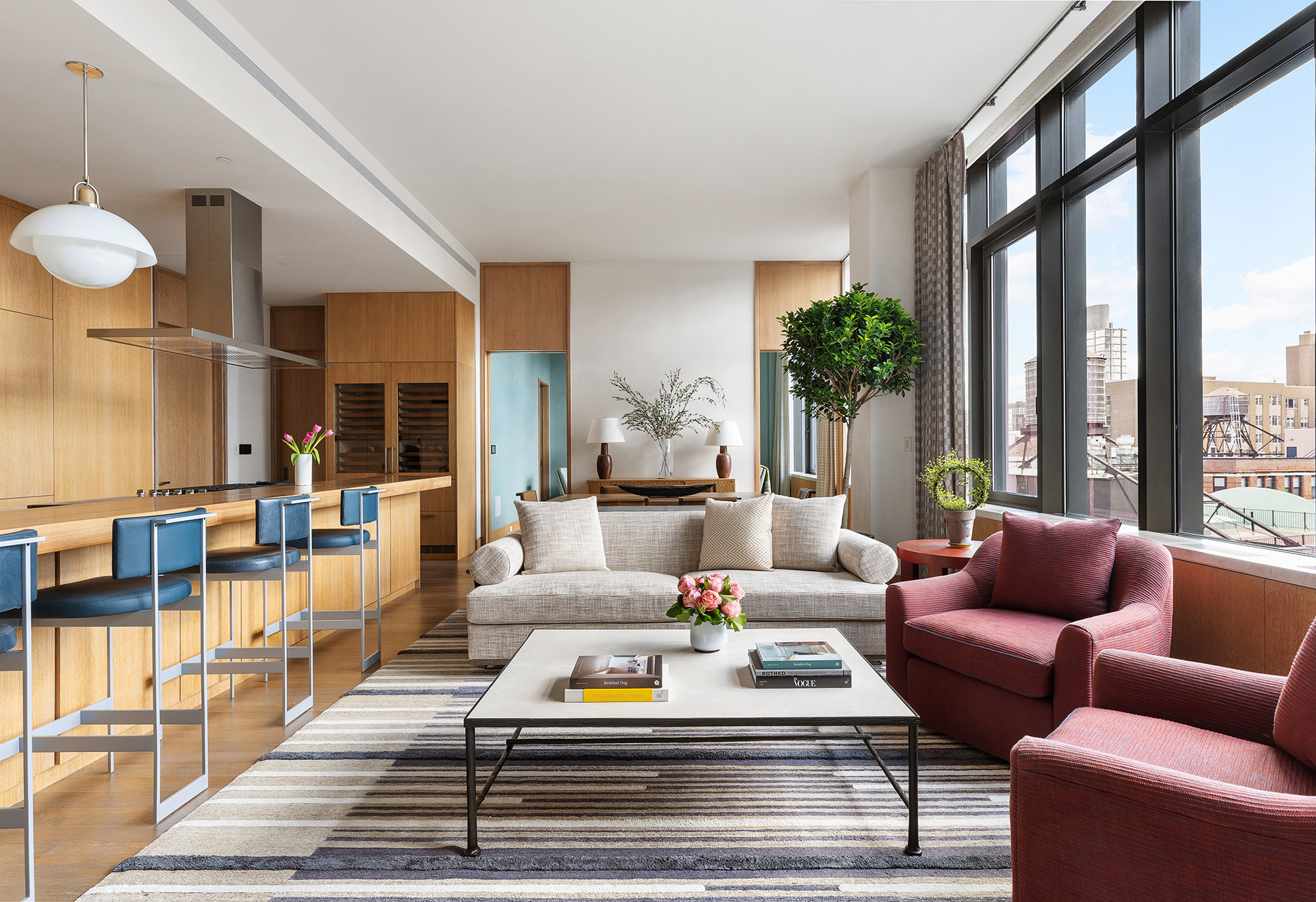 25 Bond Street, Unit PHW Manhattan, NY 10012 - Photo 9 of 34 a living room with furniture a rug potted plant and a large window