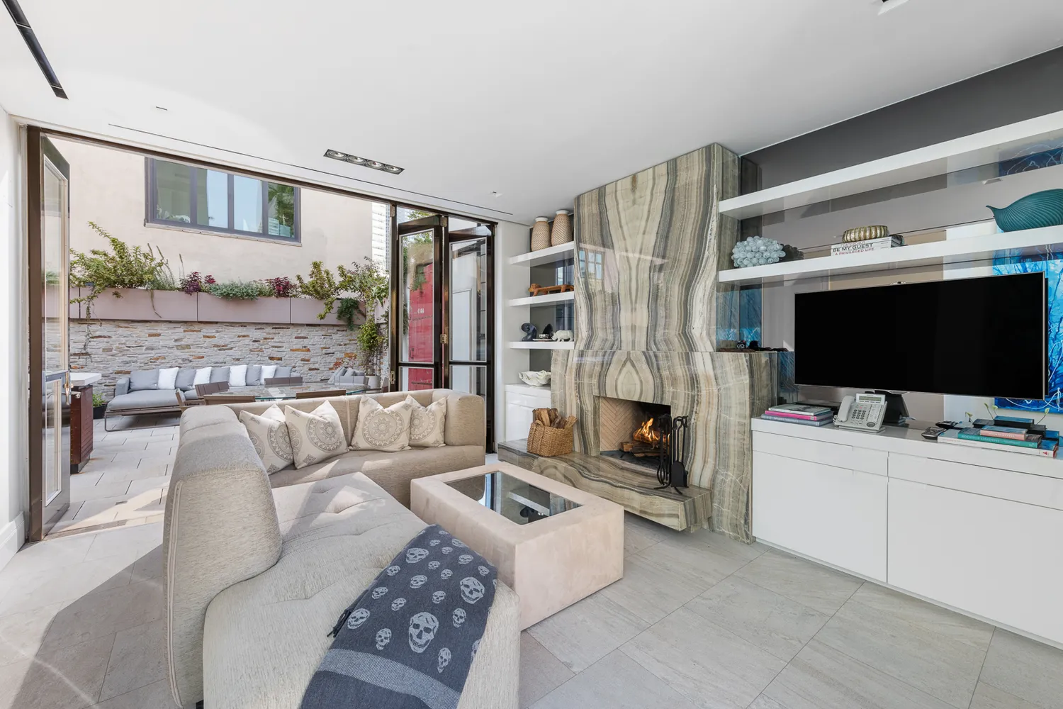 a living room with furniture and a fireplace