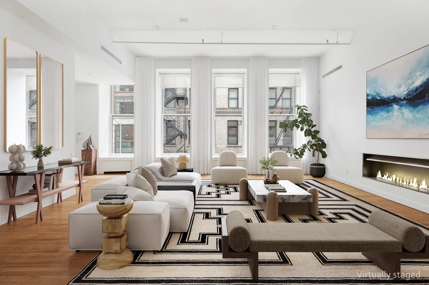 a living room with furniture wooden floor and a fireplace