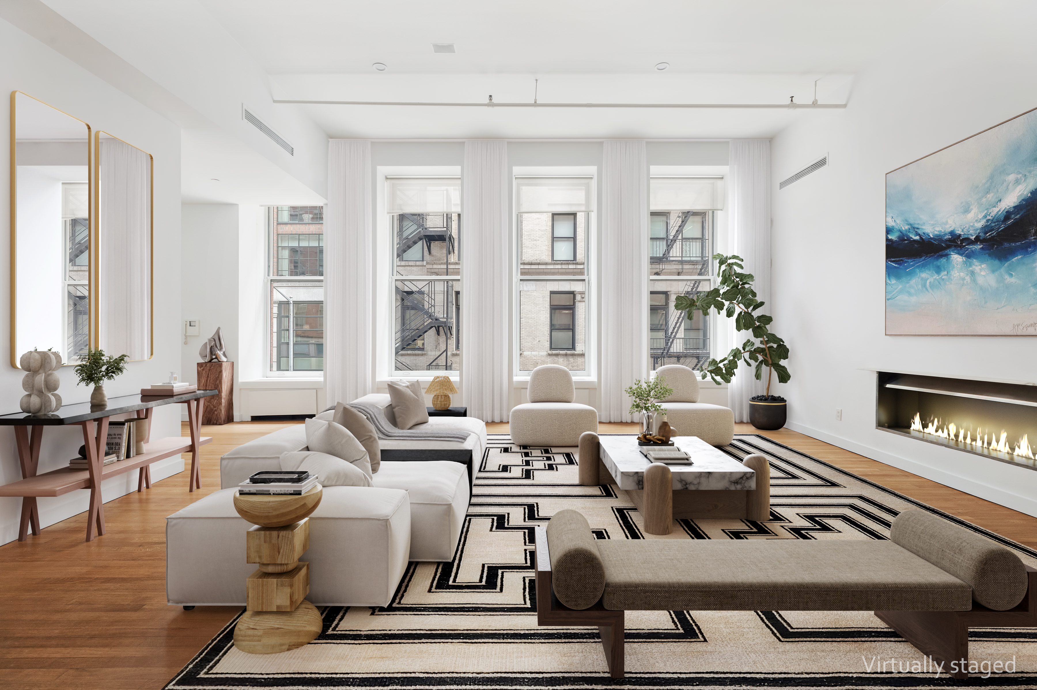 a living room with furniture wooden floor and a fireplace