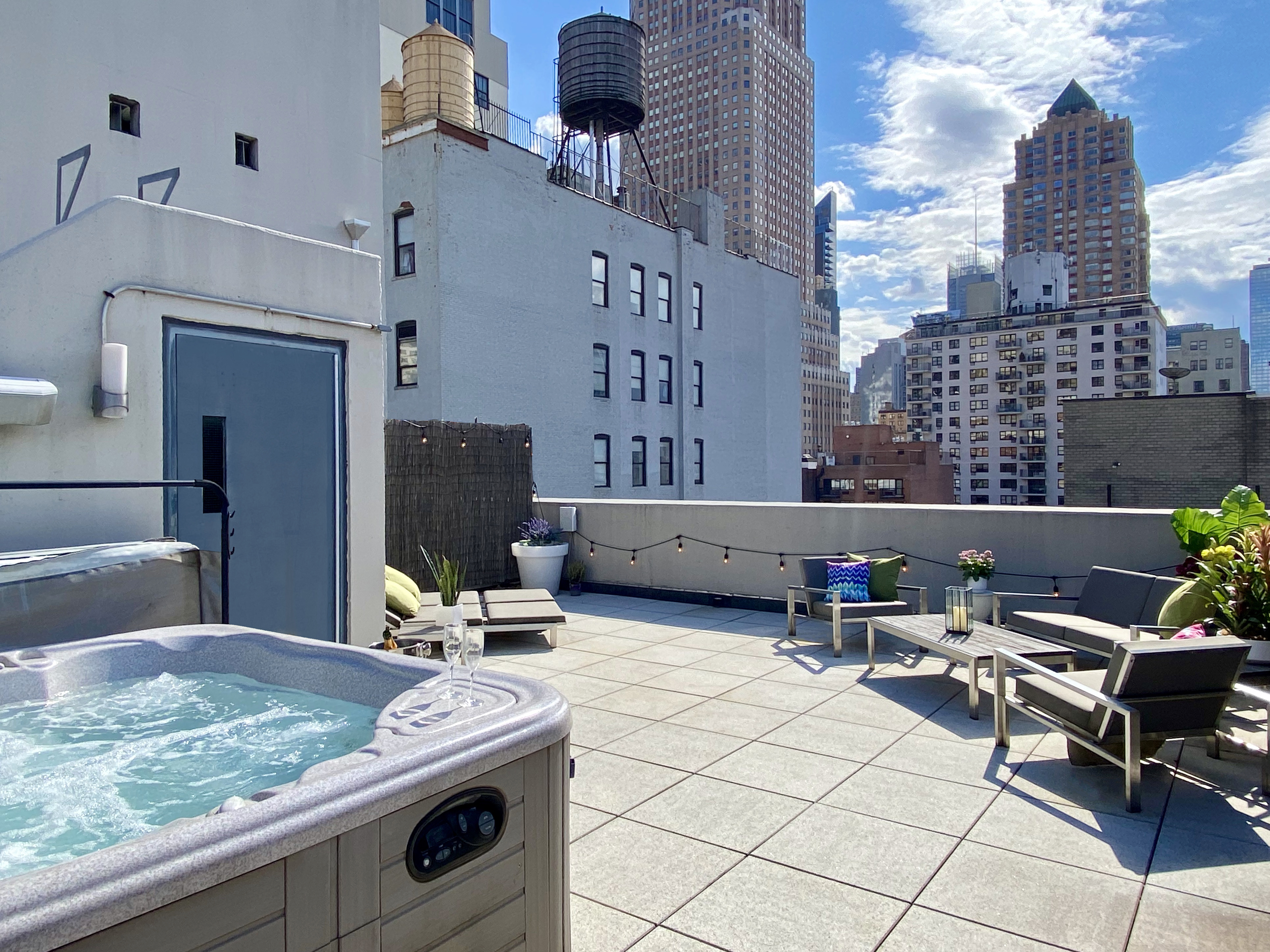 350 West 53rd Street, Unit PHA Manhattan, NY 10019 - Photo 24 of 35 a kitchen with a sink and a stove top oven