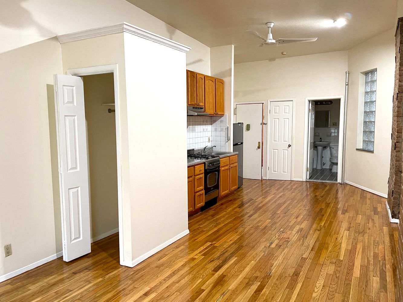 1672 Park Avenue Manhattan, NY 10035 - Photo 16 of 35 a view of a kitchen with wooden floor and a refrigerator