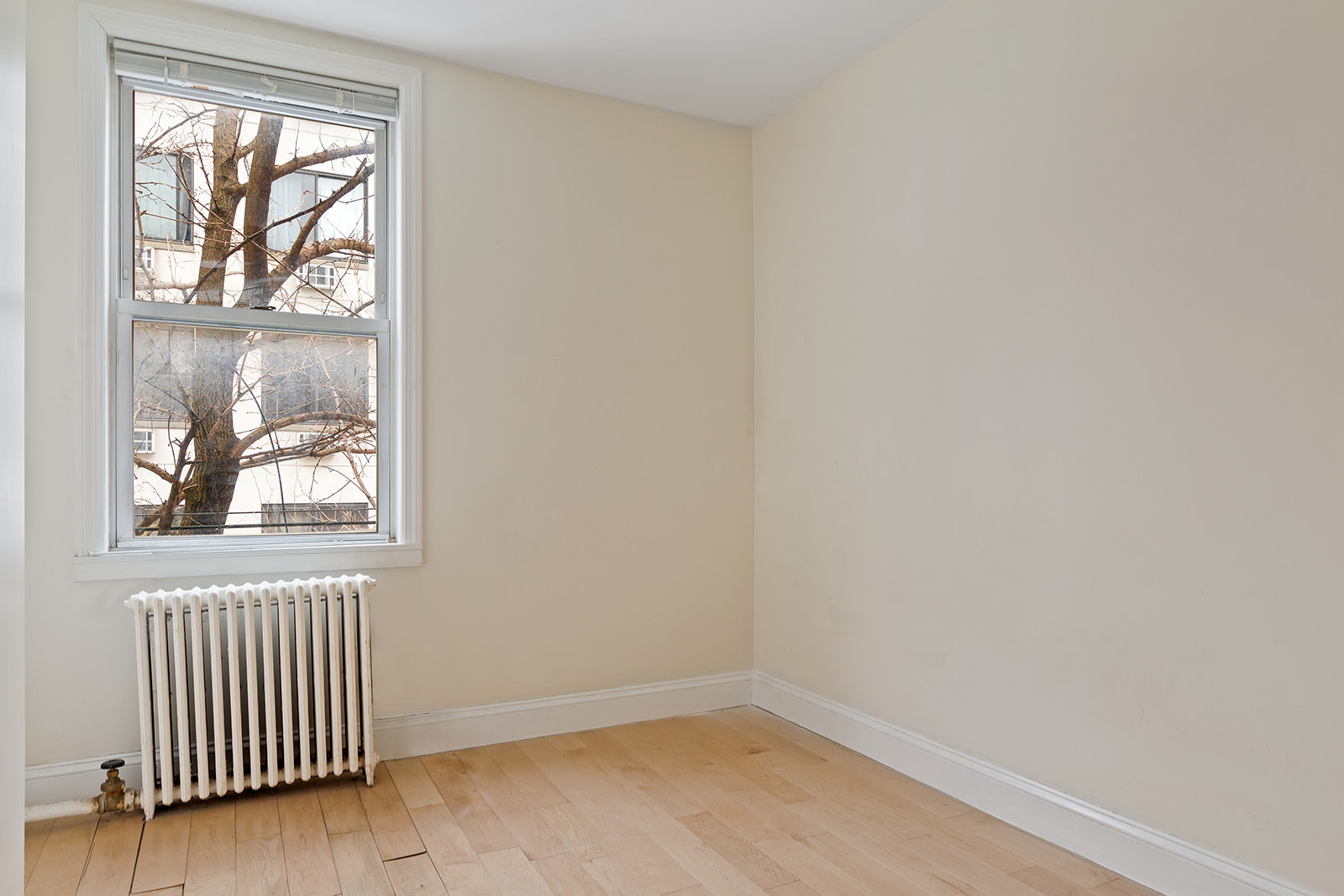 283 Devoe Street, Unit 2RR Brooklyn, NY 11211 - Photo 4 of 11 an empty room with windows