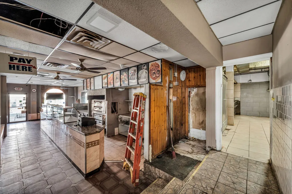 a kitchen with a stove and cabinets