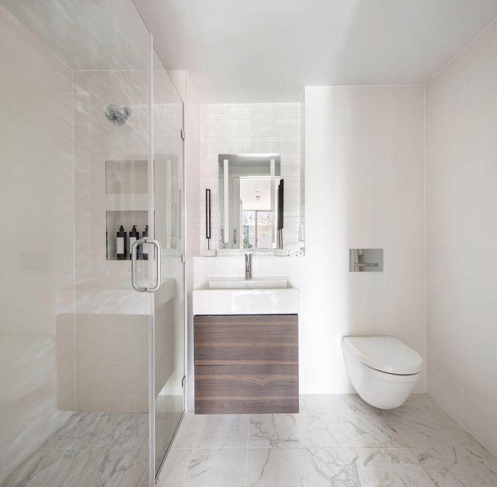 1064 Hancock Street, Unit 202 Brooklyn, NY 11221 - Photo 5 of 8 a bathroom with a sink a toilet and shower