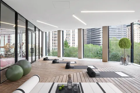 a large bedroom with a bed and a large window