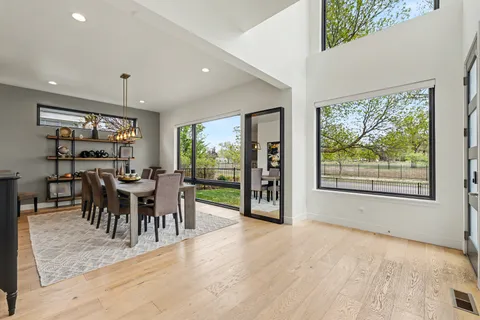 a view of a dining room with furniture window and outside view