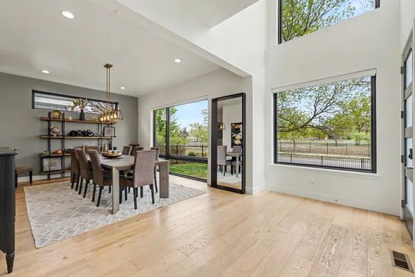 a view of a dining room with furniture window and outside view