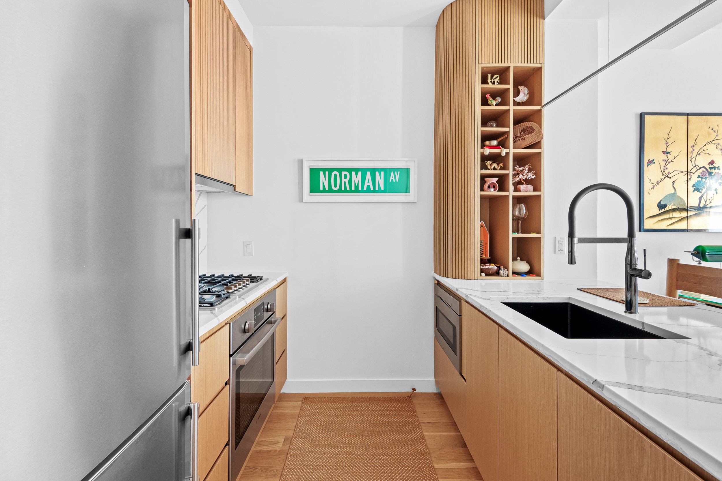 183 Mc Guinness Boulevard, Unit 6C Brooklyn, NY 11222 - Photo 5 of 12 a kitchen with stainless steel appliances granite countertop a sink and a stove