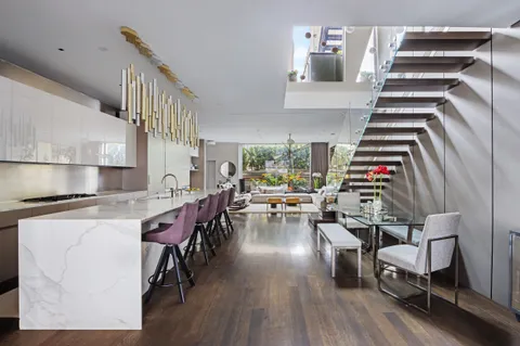 a view of kitchen and dining room with wooden floor