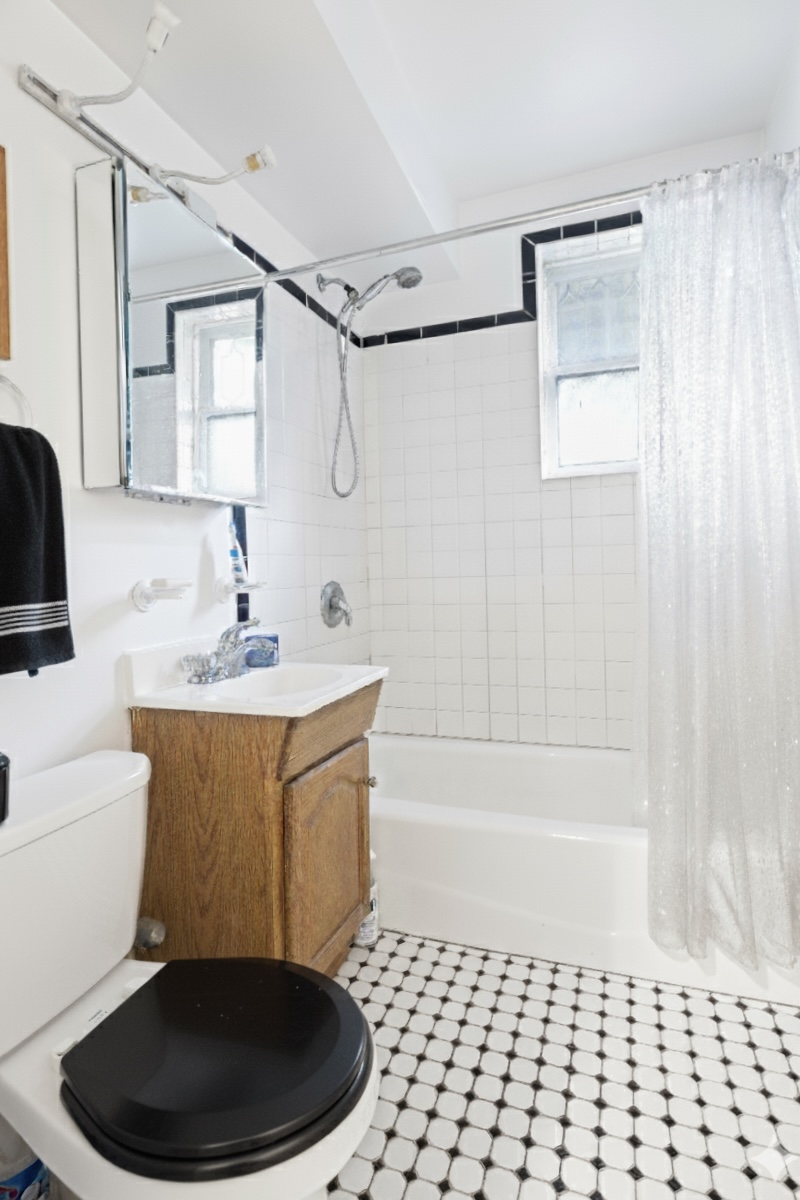 296 Garfield Place, Unit GARDEN Brooklyn, NY 11215 - Photo 8 of 12 a bathroom with a sink a toilet and shower