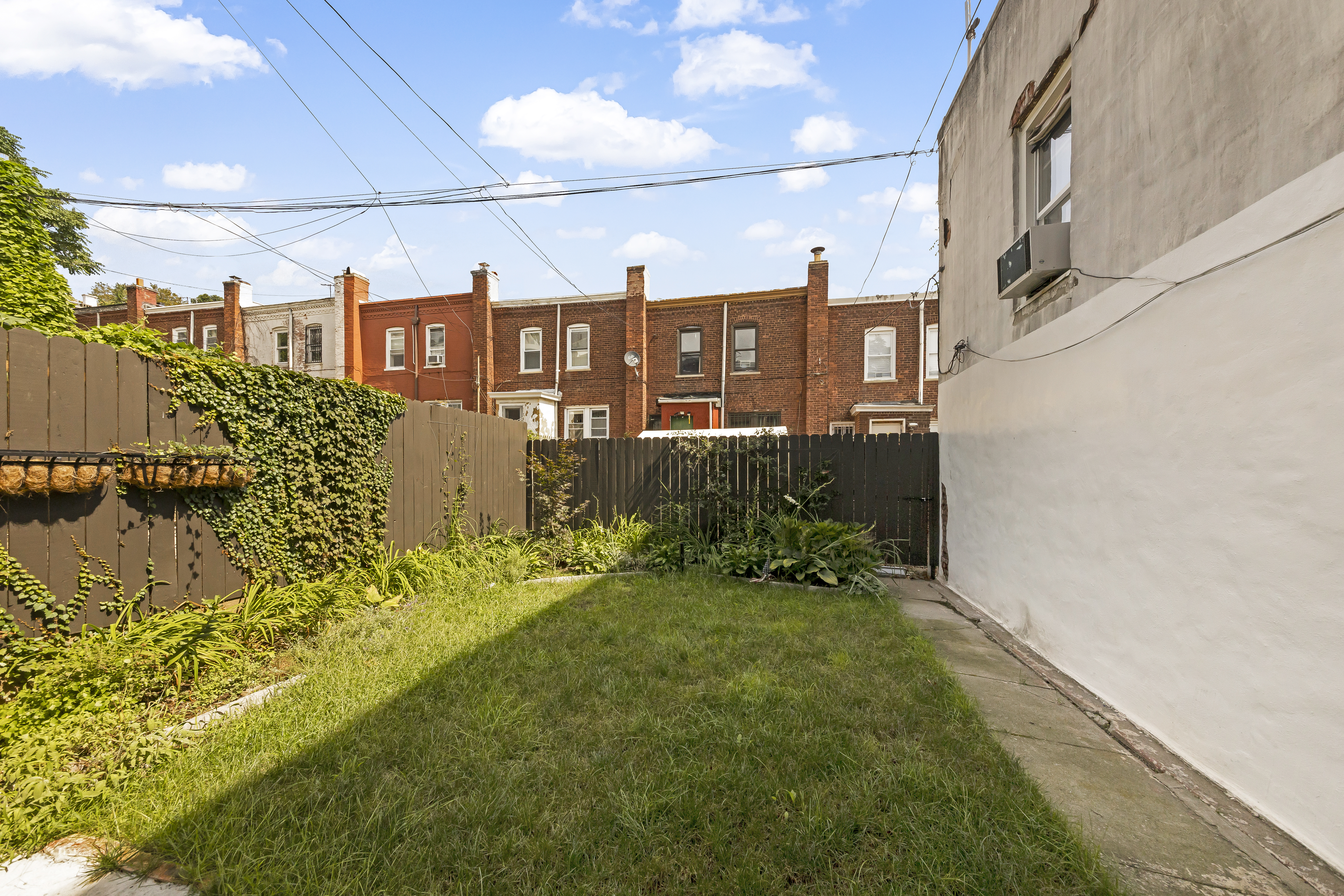 57 Hendrix Street, Unit 1 Brooklyn, NY 11207 - Photo 7 of 12 a view of a back yard of the house