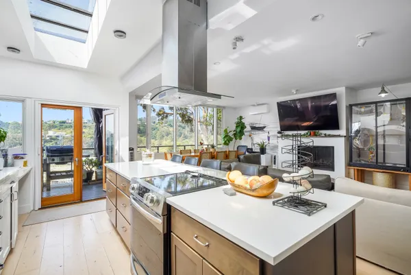 a kitchen with a stove a sink and a refrigerator